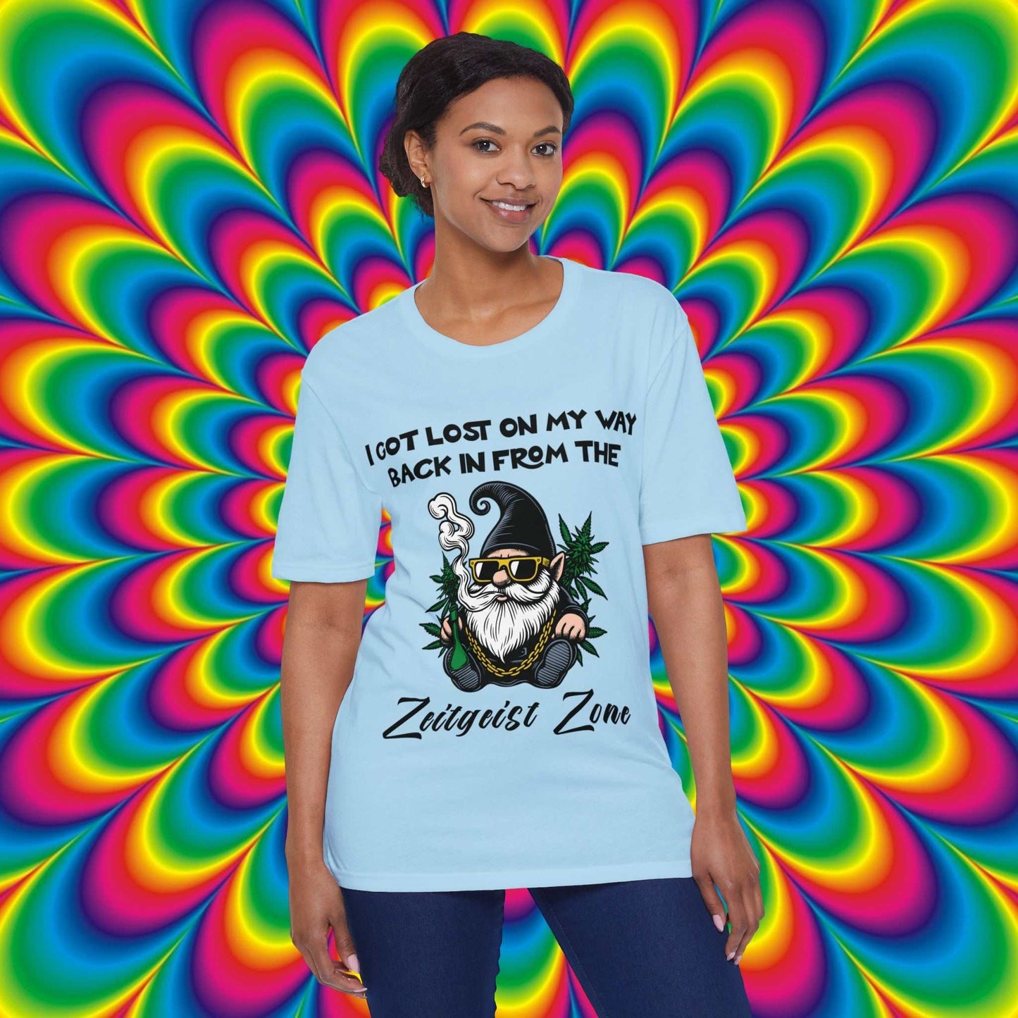 Zeitgeist Zone Person wearing crystal blue t-shirt with a graphic of a gnome smoking a pipe and text 'I got lost on my way back in from the Zeitgeist Zone'.