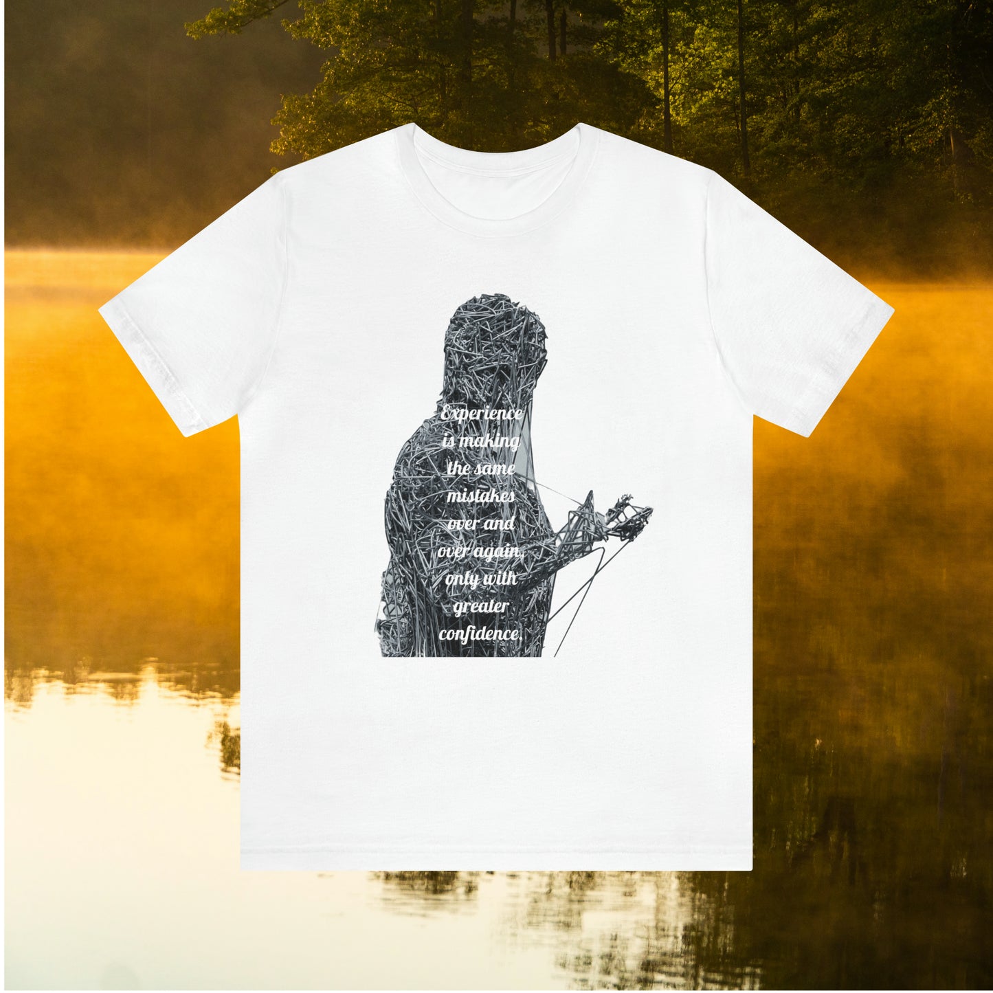 White tee on golden pond background with "Experience is making the same mistakes" monster graphic