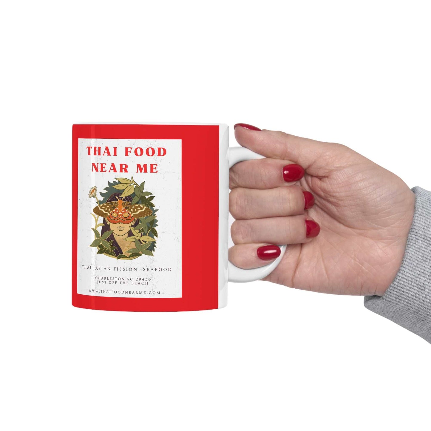 Thai Food Near Me text with graphic of young woman's head with butterfly eyes surrounded by leaves, with white background on a red cup