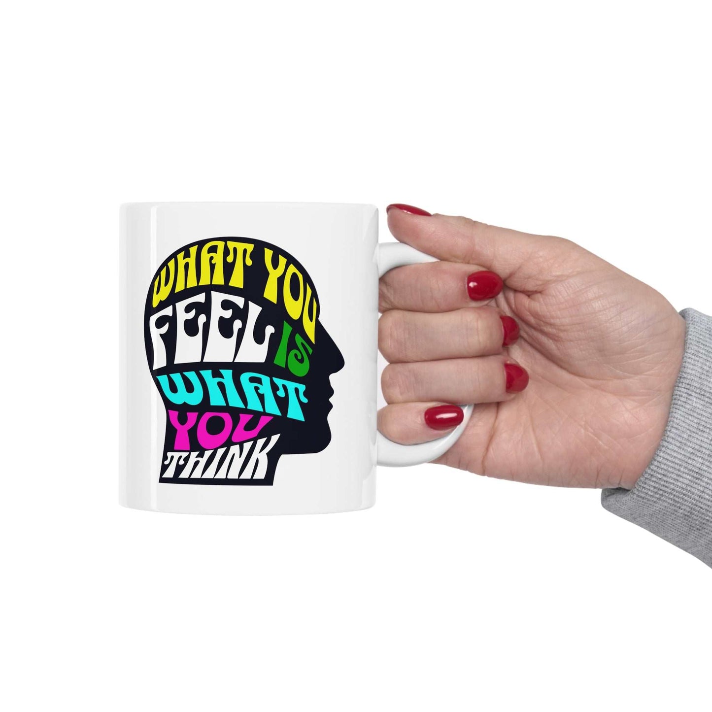 Feel and Think text is "What you feel is what you think" printed inside a shadow profile of a head on a white mug.