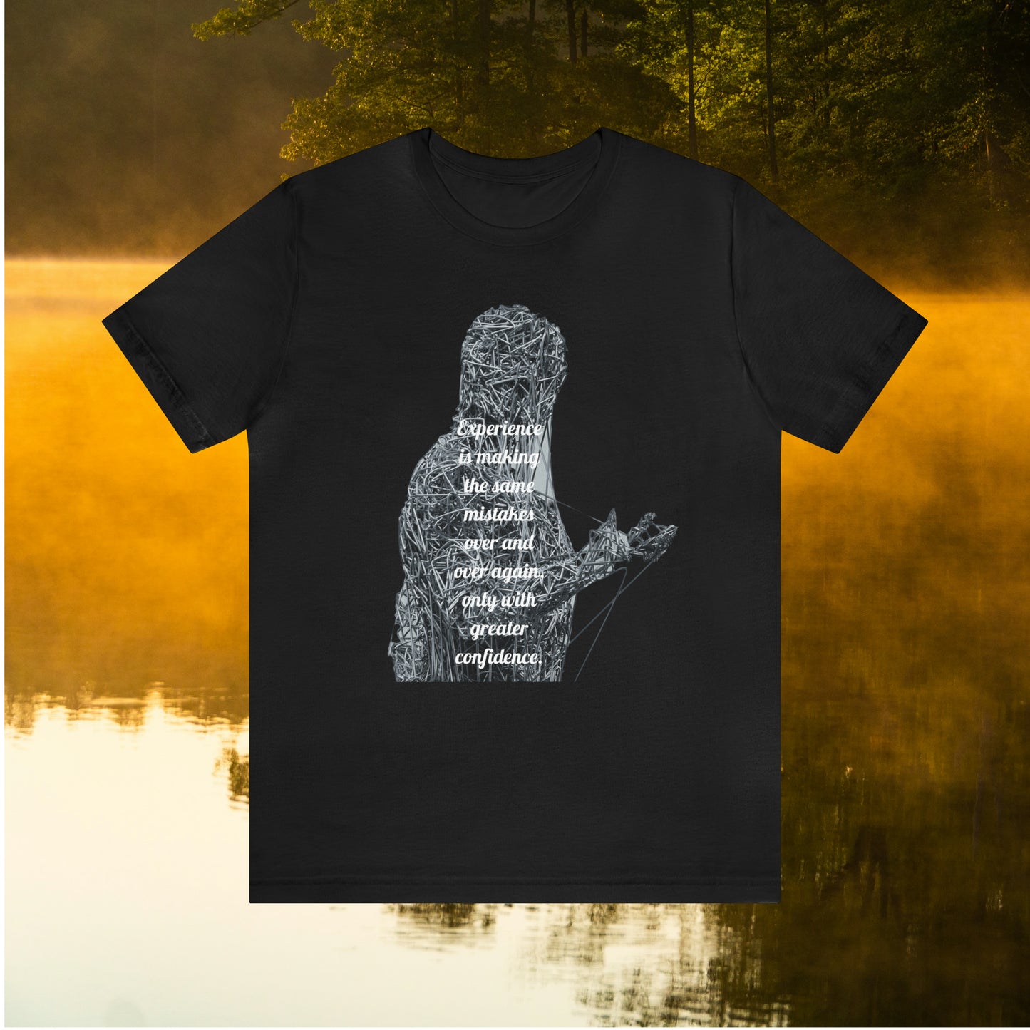 Black tee on golden pond background with "Experience is making the same mistakes" monster graphic