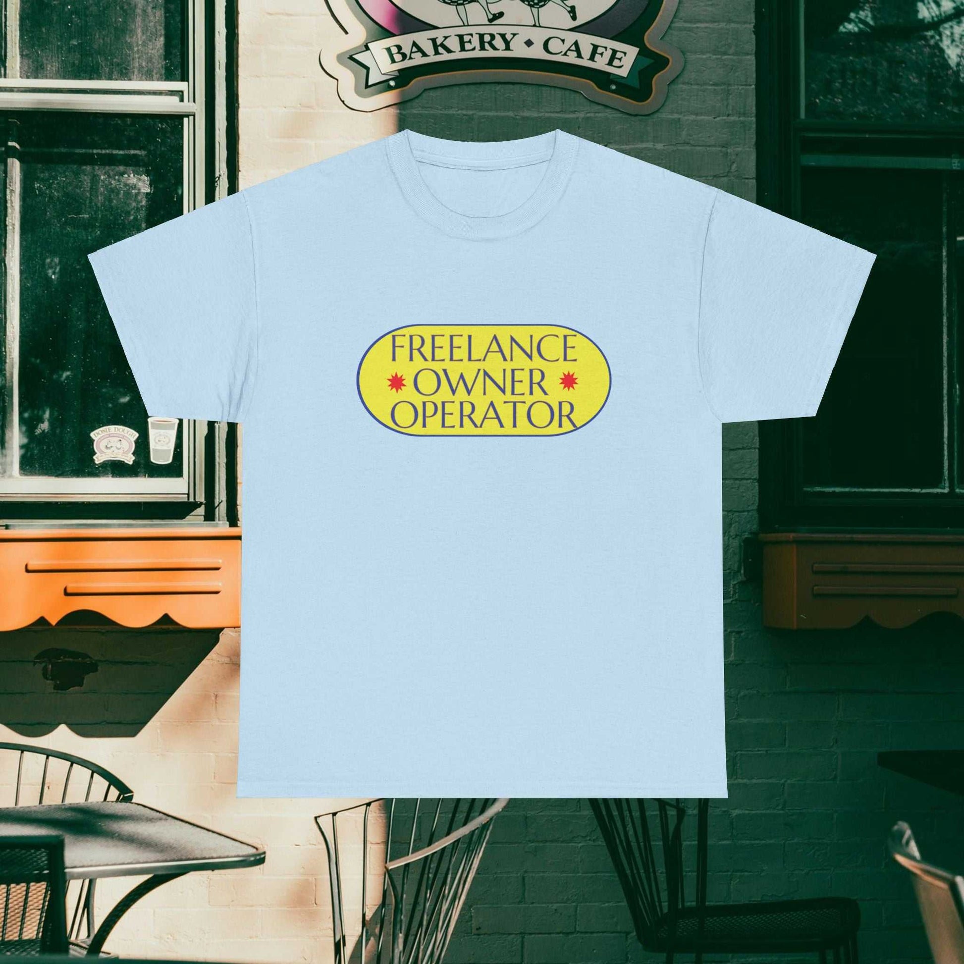 Freelance Owner Operator design on a light blue tee with vintage bakery background