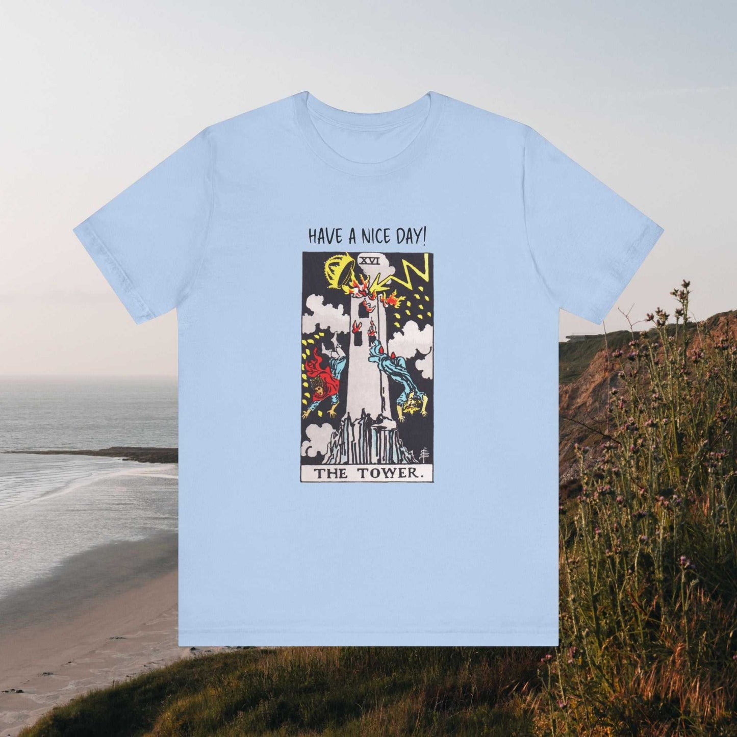 Have A Nice Day text above Tower Tarot card graphic on  alight blue tee