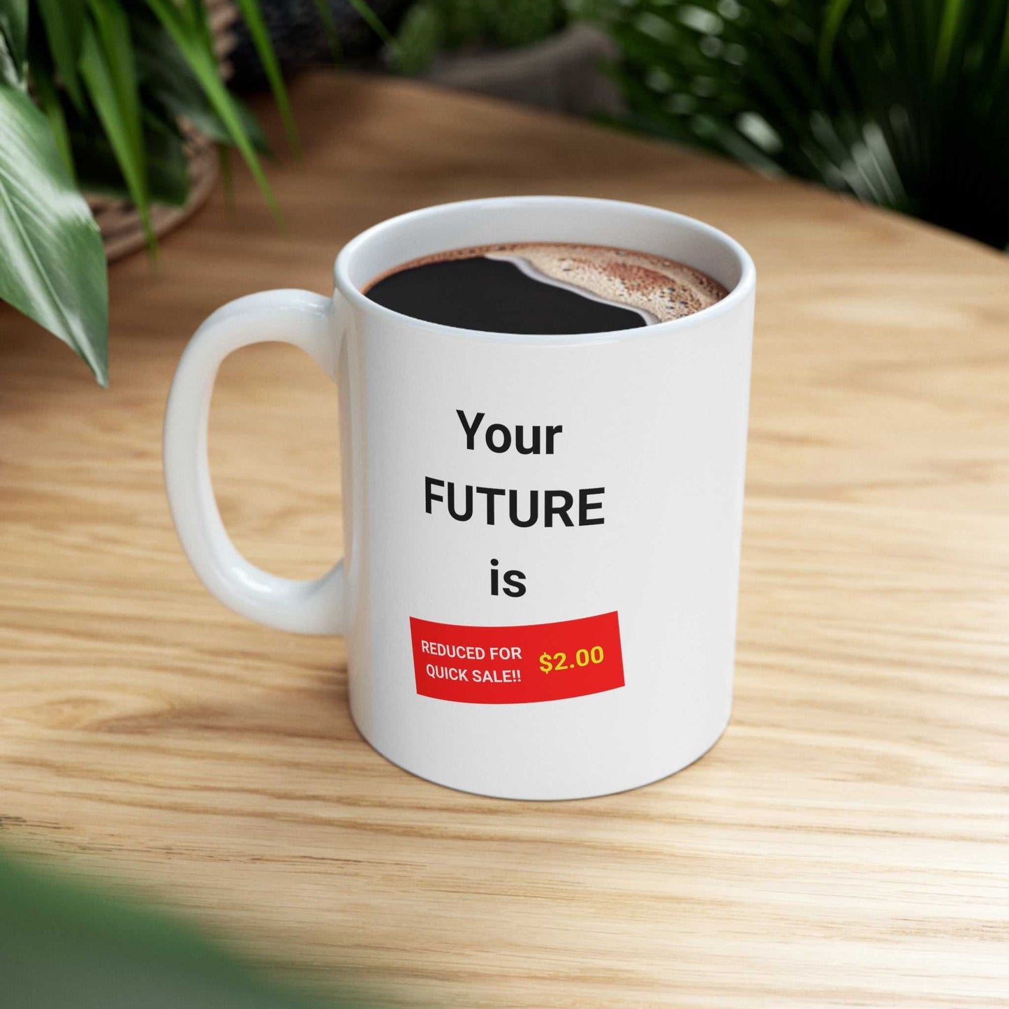 Your FUTURE is - reduced for quick sale!! $2.00 text. on a white coffee mug.
