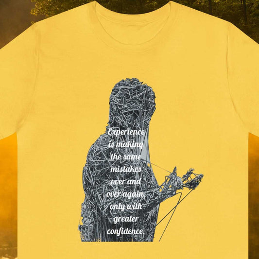 Experience is making the same mistakes over and over again only with greater confidence, text. Over person wrapped in paper clips and string", on a Yellow tee 