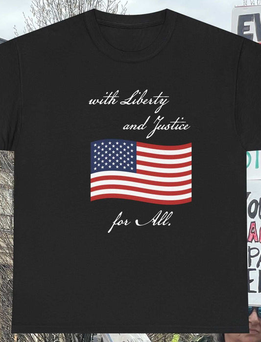 Black t-shirt with American flag and text overlayed on a protest scene